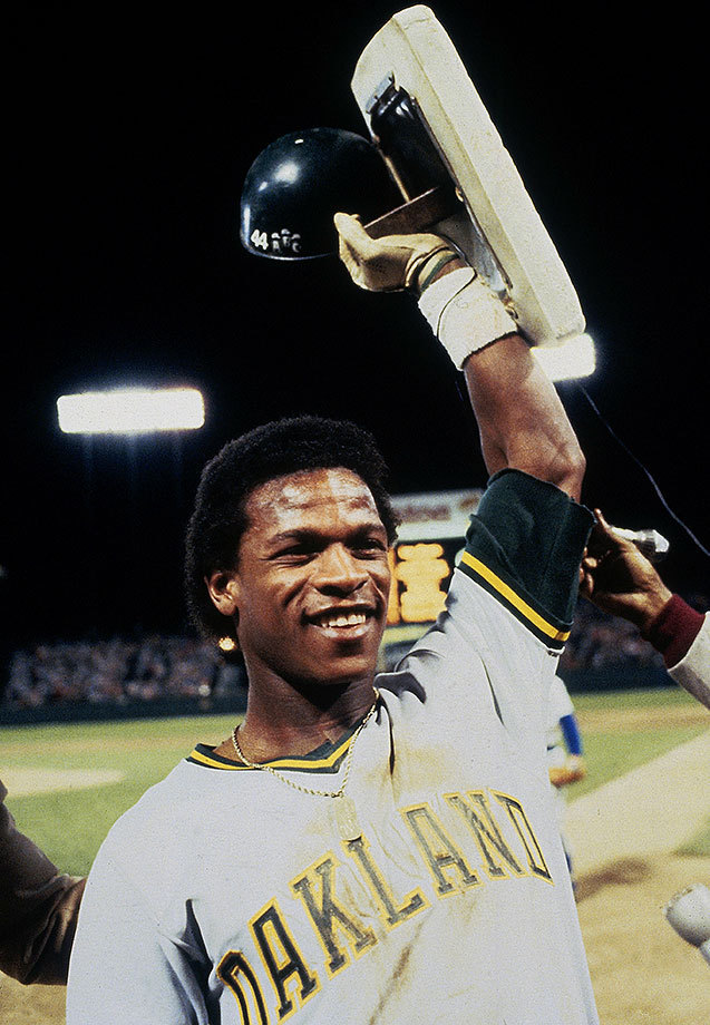 SI Photo Blog — Rickey Henderson holds up the second base bag he...