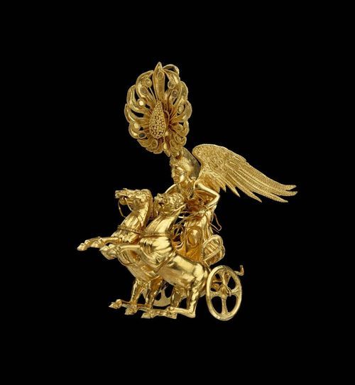 Golden earring with the goddess Nike riding  a chariot. 5 cm high, Greek, 350-325 BC