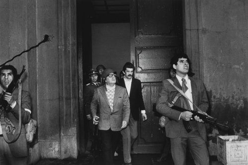 Democratically elected President Salvador Allende moments away from death during military coup at Mo