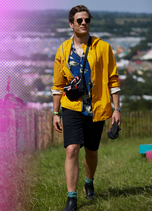 Hunterboots: James Norton wearing a bumbag and rubber ankle boots in Glastonbury, Somerset, 2019