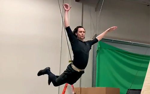 Here. Enjoy a really poor quality still of Tom Hiddleston pretending he is Peter Pan as he trains fo