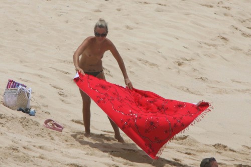 toplessbeachcelebs:  Laeticia Hallyday (Model) sunbathing topless on the beach (August 2009) 