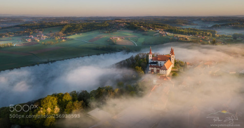 Above the foggy lake by Saintek