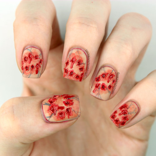 Zombie bite nail art!http://www.packapunchpolish.com/2015/10/zombie-bite-halloween-sfx-nail-art-with