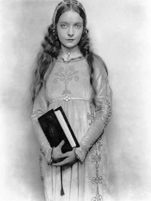 Lillian Gish, with book in hand, acts in Romola, a 1924 silent film based on the novel by George Eli