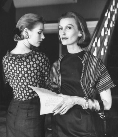 Model and Mary Jane Russell reading in sleeveless dresses topped by patterned wool jersey shrugs fri