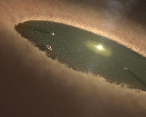 wonders-of-the-cosmos:    A protoplanetary disk is a rotating circumstellar disk of dense gas and dust surrounding a young newly formed star, a T Tauri star, or Herbig Ae/Be star. The protoplanetary disk may also be considered an accretion disk for the