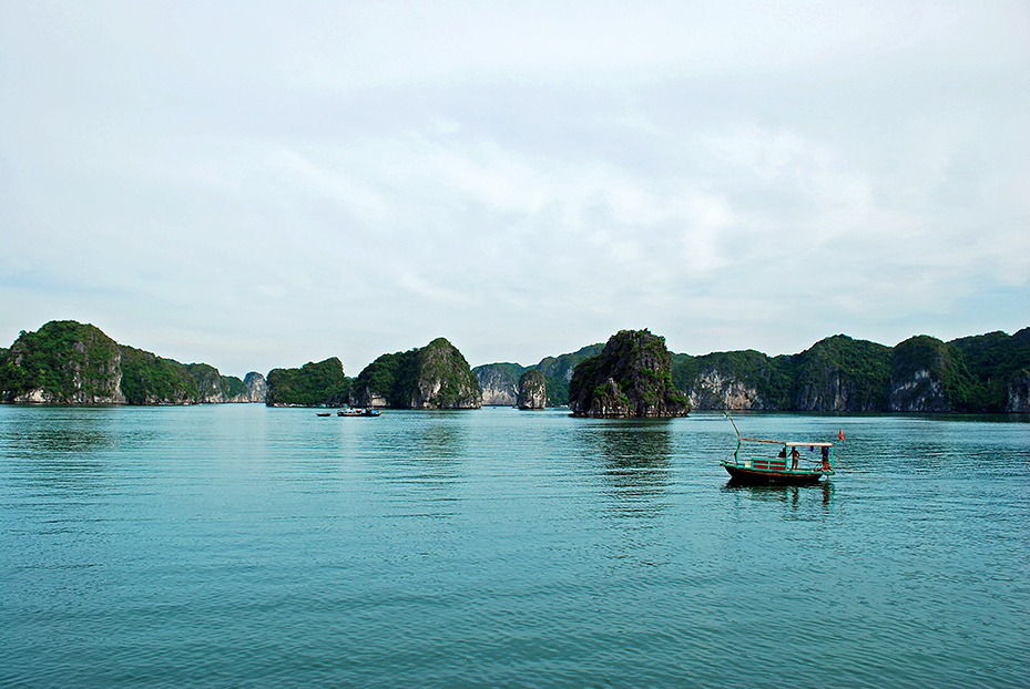 A junk boat calmly floats along the Ha Long Bay in the Cát Bà National Park, Vietnam
Photograph by Lindsay Kuczera, National Geographic Staff