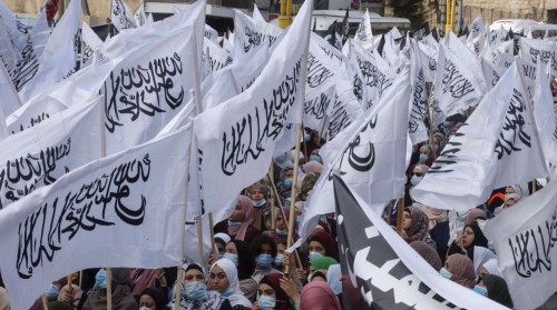 Palestinians during a rally protesting the comments by French President Emmanuel Macron over Muhamma