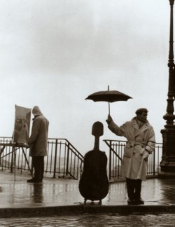 amo-vintage:  Musician in the Rain, 1957 - Robert Doisneau 