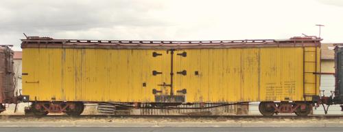 Yellow boxcar, Cumbres &amp; Toltec Railroad storage yard, Antonito, Colorado, 2006. Not at all cert