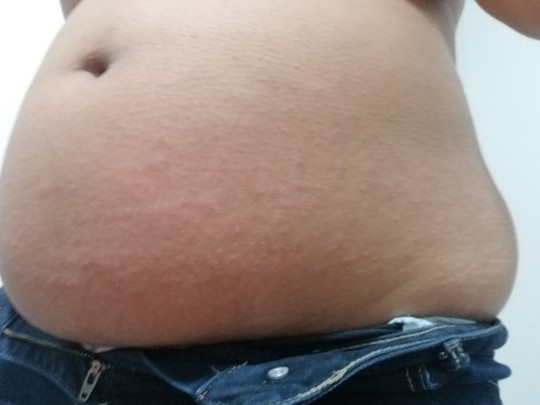 ohbelly:I can’t stop getting fatter. I’m trying to slow it down because all of my clothes are getting tight. my belly is poking out the bottom of most of my shirts, when I’m full and sit down. I can’t fit into any of my jeans and