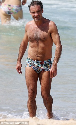 bizarrecelebnudes:  Andrew O’Keefe - Aussie Tv Presenter (Part 1) Love him. He always loves showing of in speedos by the beach. Love his hairy body. 