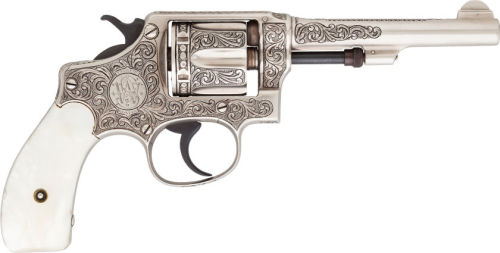 Custom engraved Smith and Wesson revolver with pearl grips. 