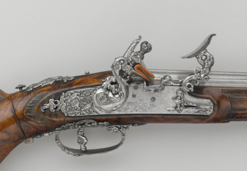 Ornate snaplock or snaphaunce carbine from Brescia, Italy.  Barrel by Lazzarino Comizzano. Artwork b