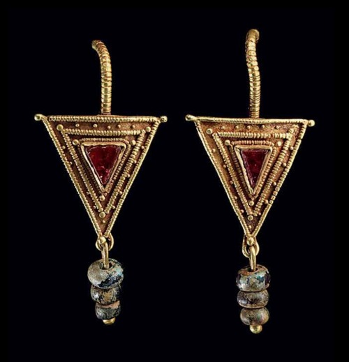 Pair of Roman gold, garnet, and glass earrings, c. 2nd-3rd centuries CE. From Christie’s auctions.