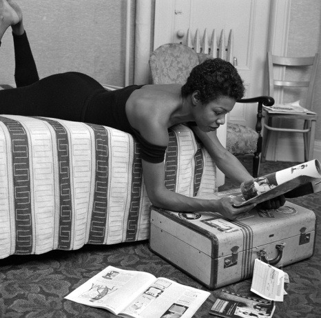 Maya Angelou reading in her dressing room before her performance at the Village Vanguard in New York