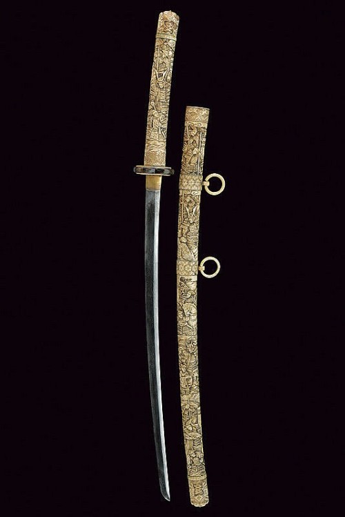 Japanese katana with carved bone scabbard and hilt, 19th century.