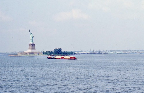 Lower Hudson River With Statue of Liberty and Barge from Staten Island Ferry, New York, 1969.