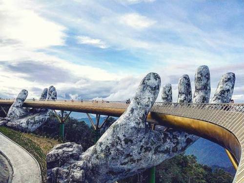 itscolossal:Vietnam’s Newly Opened Pedestrian Bridge Lifts Visitors with a Pair of Giant Weathered H