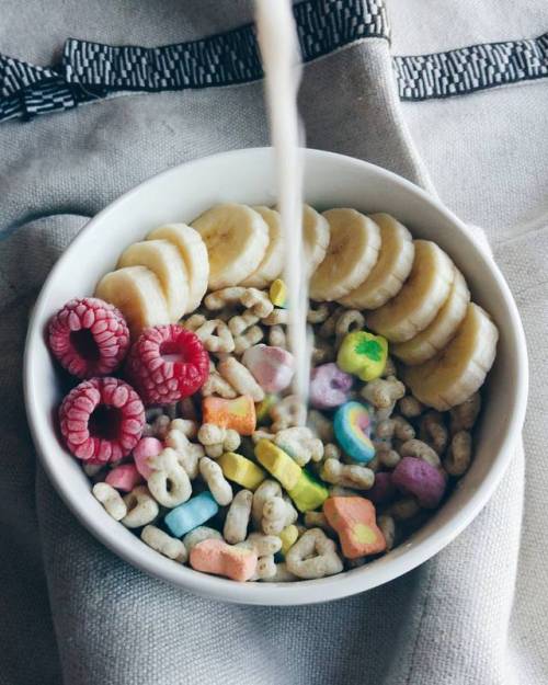 Rainbow breakfast makes everything better - Lucky charms, banana, raspberries and almond milk