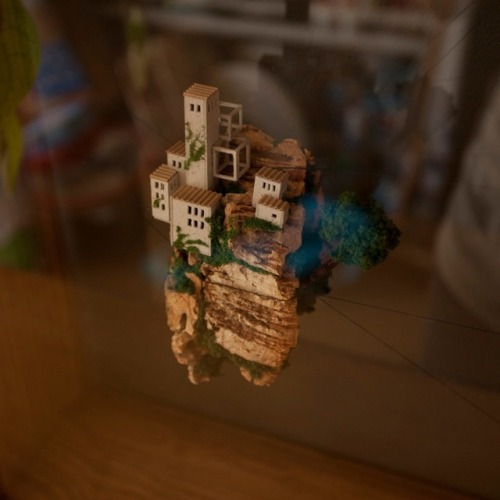 archatlas:  Miniature Houses on Cork Cliffs Float Inside Handmade Wooden Frames by Rosa de Jong  Designer Rosa de Jong produces micro homes that are built into the side of tiny cliffs constructed out of cork. Her miniature environments are covered in