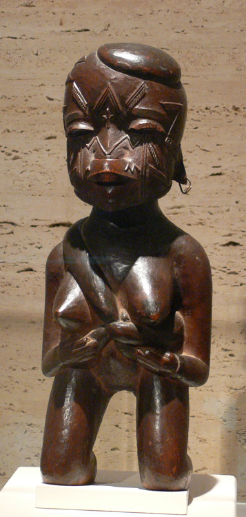 Sculpture of a kneeling mother holding her child, from the Makonde people of southeastern Tanzania a