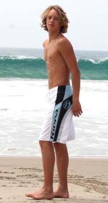 itsswimfever:  Blond buck in boardshorts…