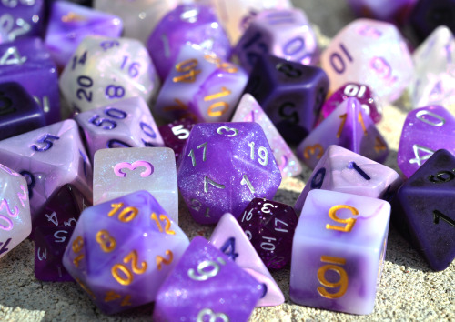 floralprintshark:[ID: three photographs of an assortment of tabletop gaming dice in different shades