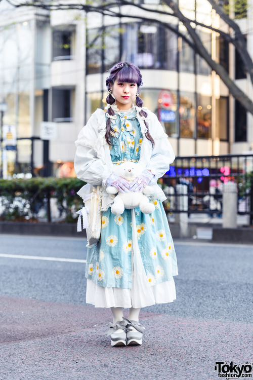 19-year-old Japanese student Rio on the street in Harajuku with purple twintails, a vintage top over