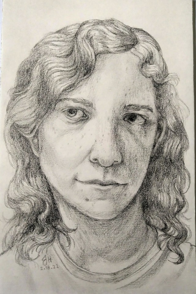 A pencil front portrait of a person. They have white skin with freckles & medium-toned, wavy hair that reaches their shoulders. Their head is tilted slightly; they smile slightly & look to the side.