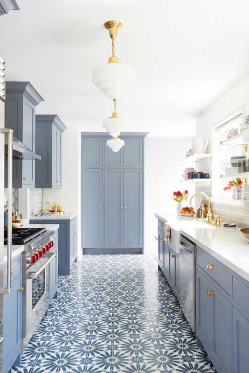 Forget hardwoods: We&rsquo;re floored by the tile floor in this blue kitchen.