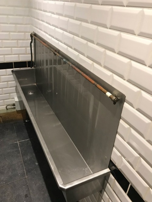 trough urinal at a restaurant in the Grand Bazar shopping in Antwerp. Taverns Passage.  It was diffi