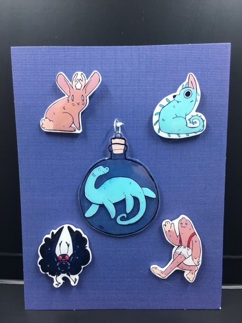 Some cryptid pins + nessie charm i made for my sister