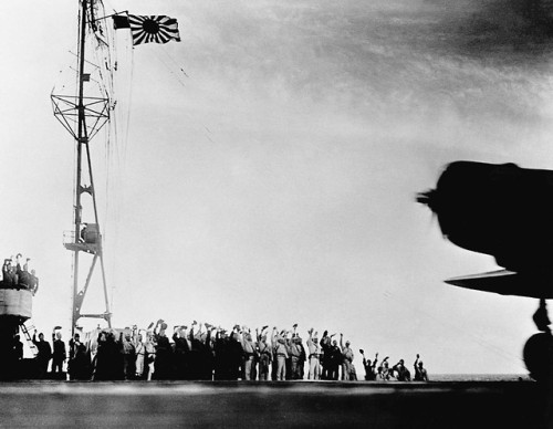 Sailors cheer as planes take off from a carrier to attack PearlHarbour (December 7th,1941).Japanese 