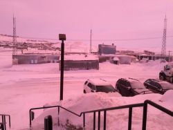 coolthingoftheday:  Canada’s northernmost capital city, Iqaluit, briefly turned pink and purple on January 12th, 2016. A CBC meteorologist explained that the incident was most likely due to a phenomenon called light scattering, which is caused by the