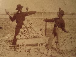 sixpenceee:  American soldiers playing around with human skulls in Colon Cemetery in Havana, Cuba, during the 1900’s.