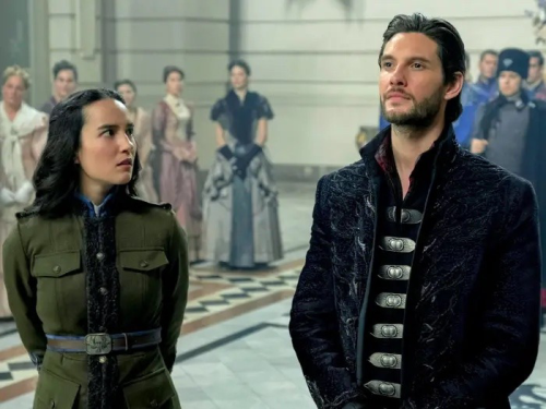 Alina and the general in the throne room, Alina looks over at the Darkling to know what to do