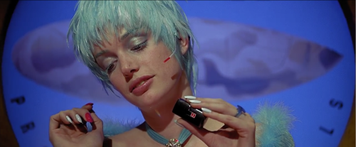 Sibyl Buck, Zorg’s secretary in The Fifth Element (1997), paints her nails while wearing Jean Paul G
