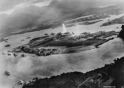 A plume of water erupts as a torpedo strikes the USS West Virginia(BB-48), anchored in Battleship Ro