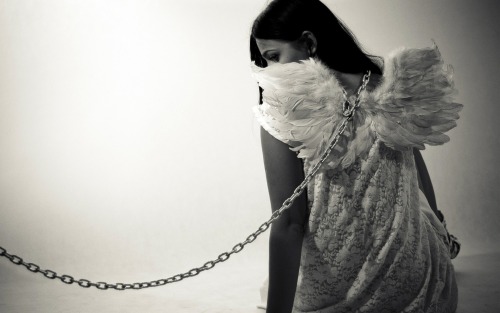 kittiesnlollies:  Angel chained.  There’s a thought!   ♥