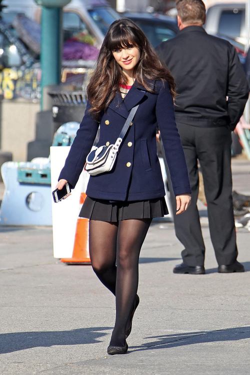 Zoey Deschanel is a cute skirt and black tights