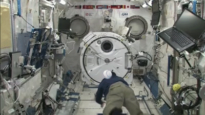 Astronaut Satoshi Furukawa races a baseball in space
