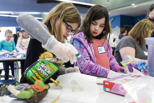 Needham residents gather donations for Cradles to Crayons at Needham High School on April 7, 2018.