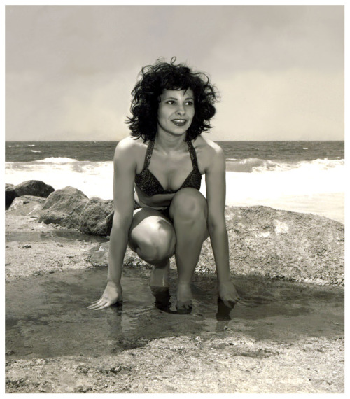 Sex Patti Waggin poses in a tidal pool..   Scanned pictures