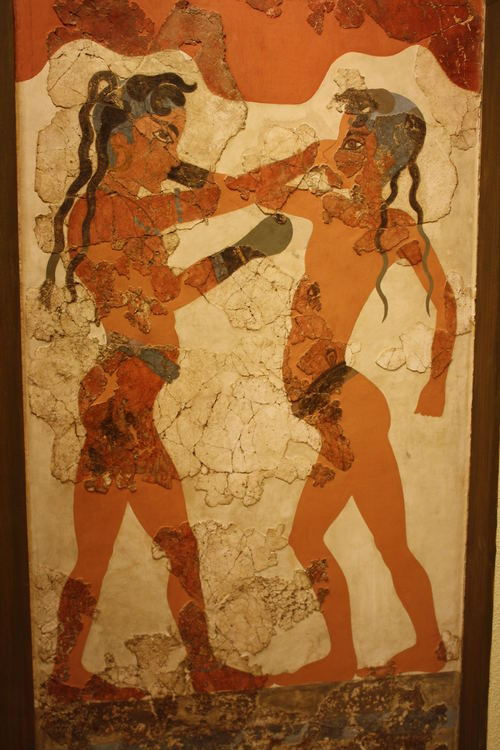 Boxers Fresco at Akrotiri on Santorini (c. 1700 BC).The red colouring used to depict the boxers sugg