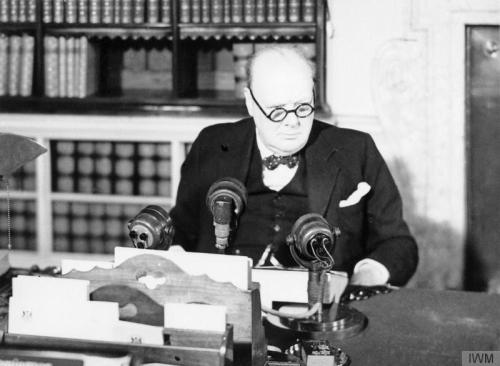 worldwar-two:Prime Minister Winston Churchill at a BBC microphone about to broadcast to the nation o