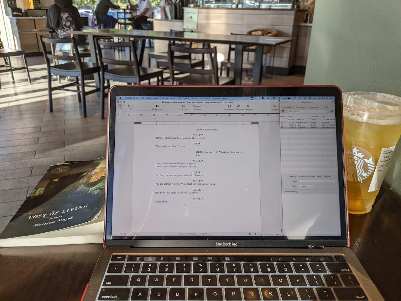 Pictured: a photo of a laptop with a script written in Final Draft in a Starbucks Coffee Shop.