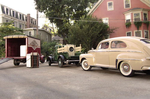 photojojo:  Michael Paul Smith builds 1/24 scale replicas of retro scenes and cleverly photographs them against backdrops in his neighborhood. The result is incredibly convincing scenes of early 19th century cars rolling down suburban streets. Some of