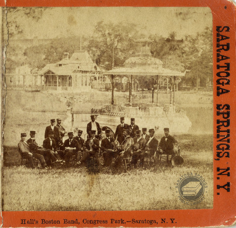 According to the caption on this stereoview, this is Hall’s Boston Band gathered on the lawn in Cong